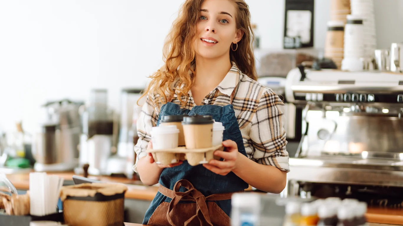 Panama specialty coffee - Friendly Server Holding Coffee Drinks In Cafe